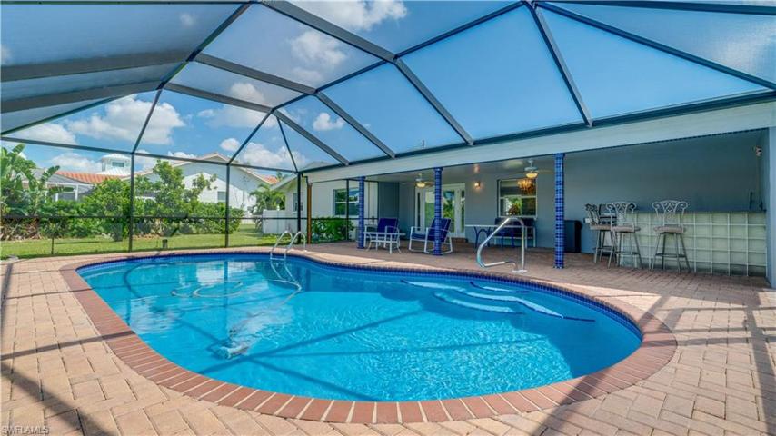 Beautiful large pool newly resurfaced with new pool cage.