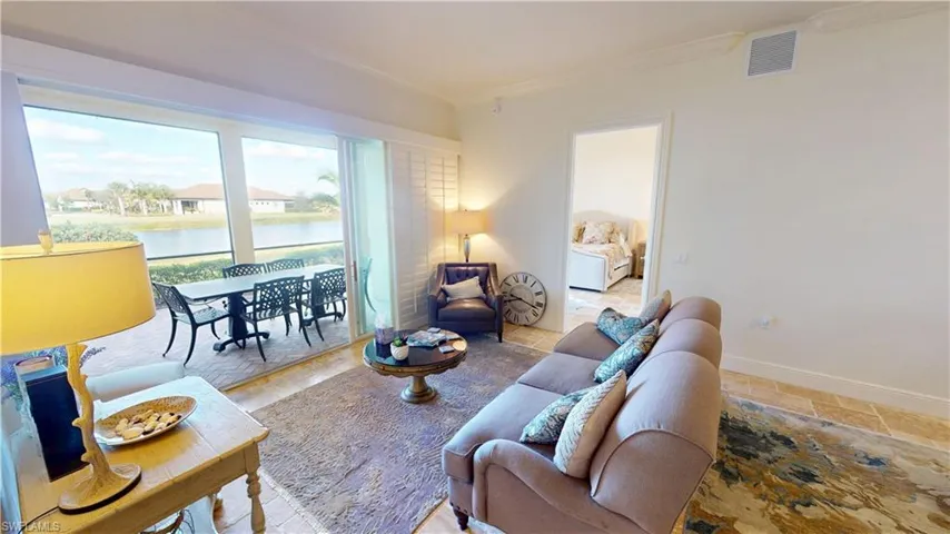 Living room with a water view and ornamental molding