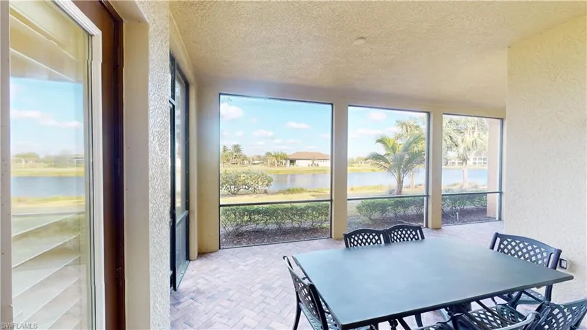 Sunroom with a water view