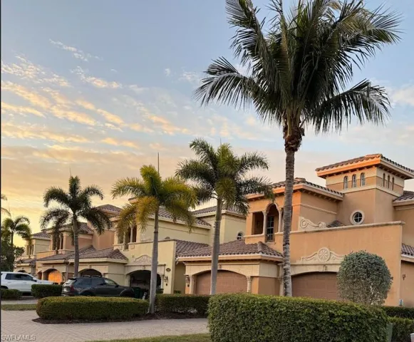 View of property featuring driveway