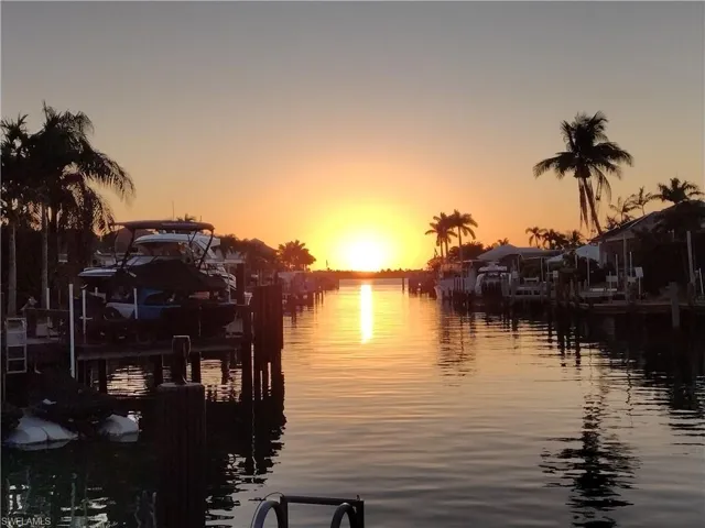 Property view of water with a dock