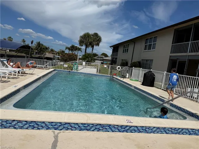 Community pool featuring a patio area