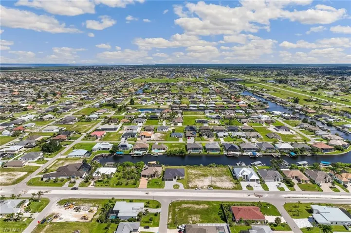 Aerial view of residential area with a nearby body of water