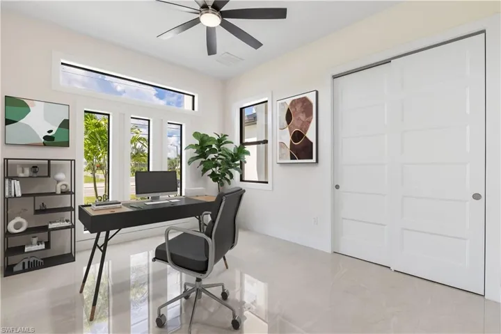 Office space with ceiling fan and baseboards furnished