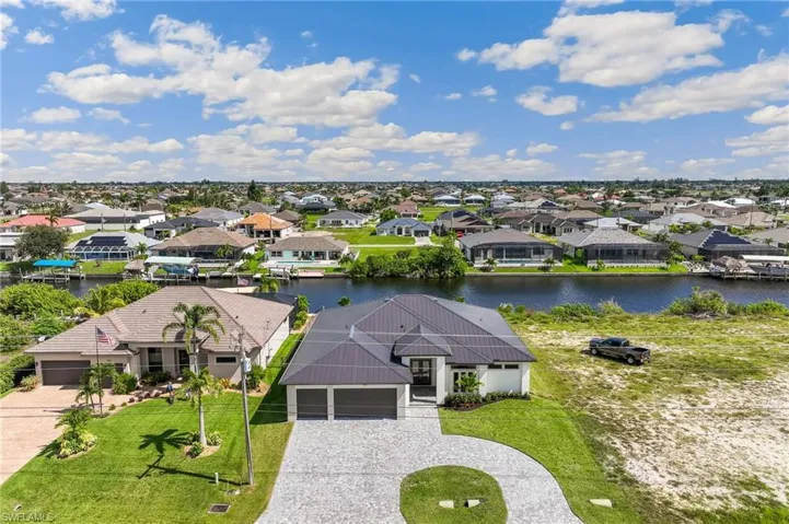 Aerial view of residential area with a large body of water