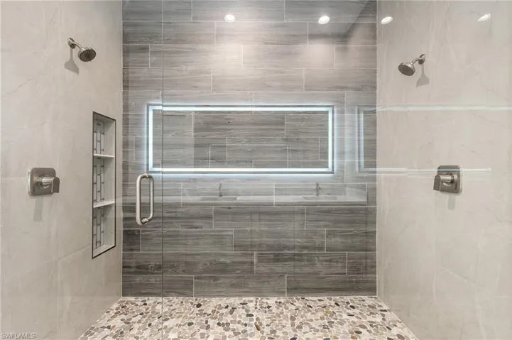 Full bath featuring a shower stall