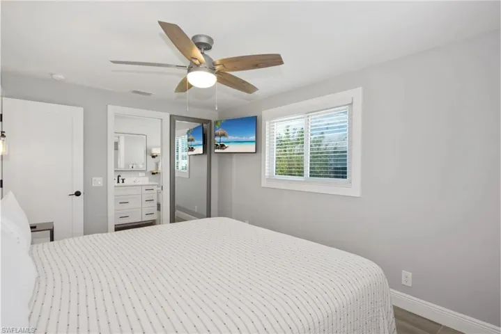 Comfortable bedroom with ample closet space  (Beach home 1) - Virtually Edited Image