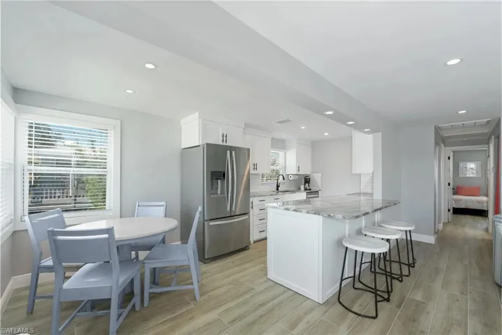Functional kitchen and dining space with a focus on both style and practicality (Beach home 1) - Virtually Edited Image