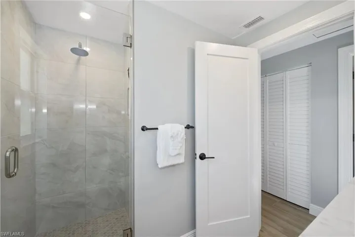 Modern bathroom with a walk-in shower (Beach home 1) - Virtually Edited Image
