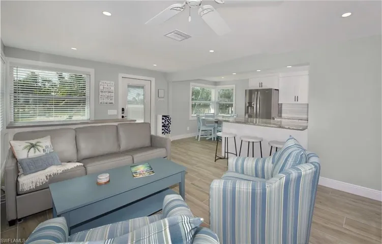 Open-concept living area perfect for entertaining (Beach home 1)  - Virtually Edited Image