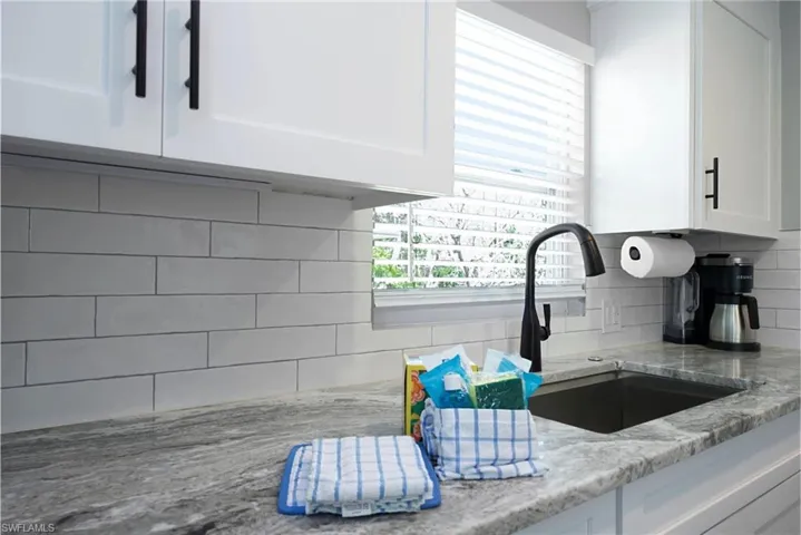 Stylish kitchen showcasing updated fixtures and a contemporary design (Beach home 2) - Virtually Edited Image