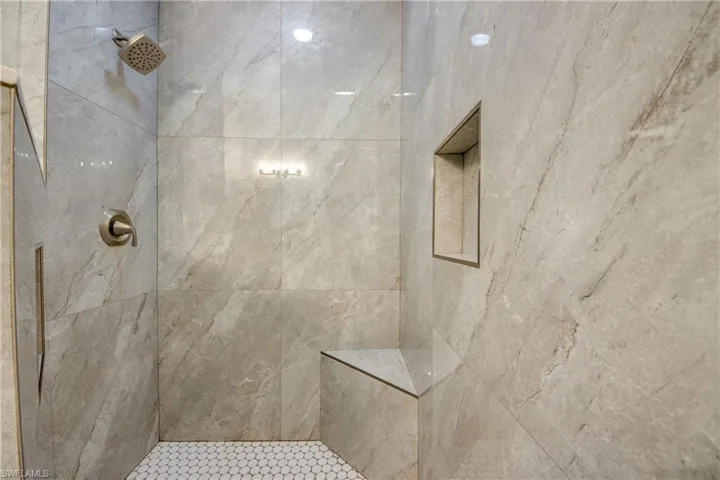 WALK-IN SHOWER WITH NO DOOR TO CLEAN.