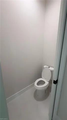 Bathroom with baseboards and toilet