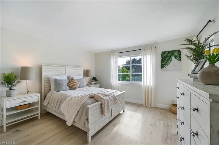 Bedroom featuring light wood-style flooring and access to exterior