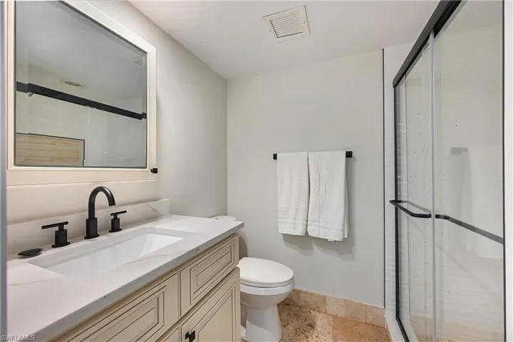 Brand new tile shower and glass door.