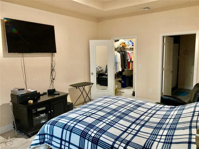 Bedroom with a closet and a spacious closet