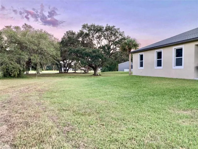 View of yard at dusk