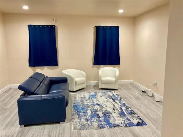 Sitting room featuring light wood-type flooring