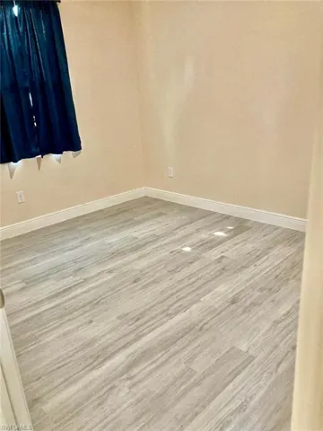 Spare room featuring light hardwood / wood-style flooring