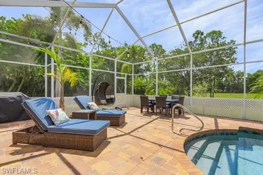 Pool with a lanai and a patio area