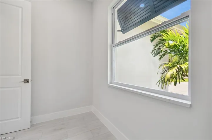 Spare room with light wood-type flooring