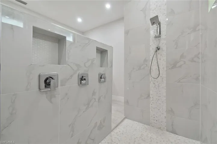 Bathroom featuring tiled shower