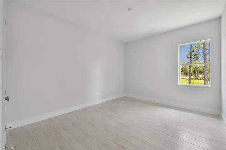 Spare room featuring light hardwood / wood-style flooring