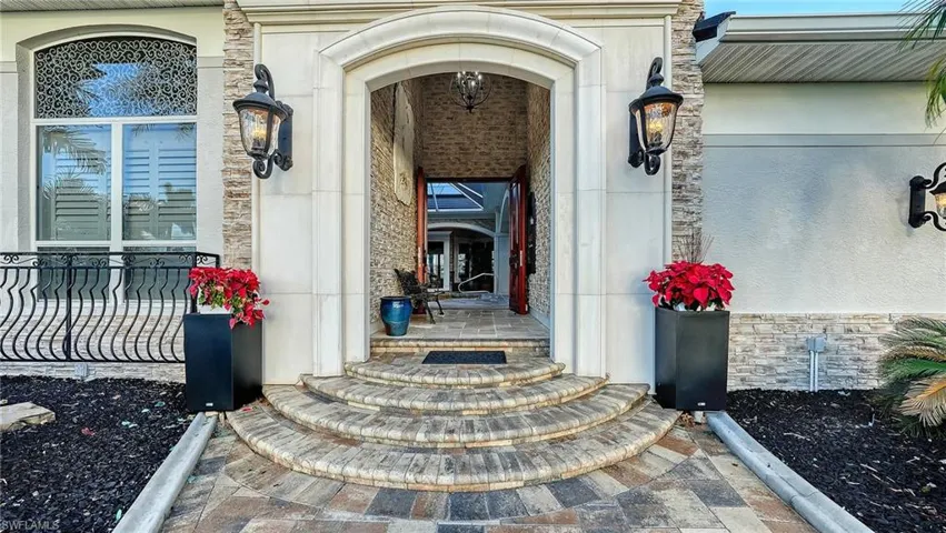 Property entrance with stone siding