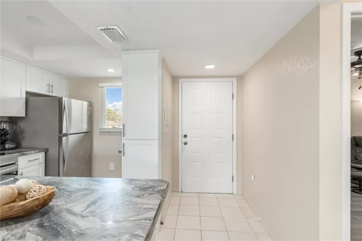 Front door and kitchen