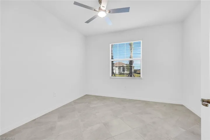 Full bath with walk in shower, double vanity, light tile patterned floors, and recessed lighting