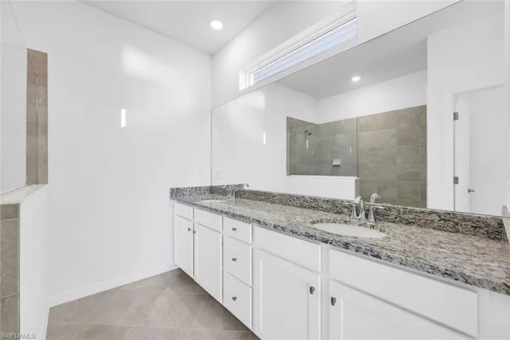 Spacious closet featuring light tile patterned floors