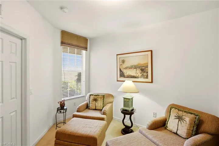 Sitting room with carpet flooring and baseboards