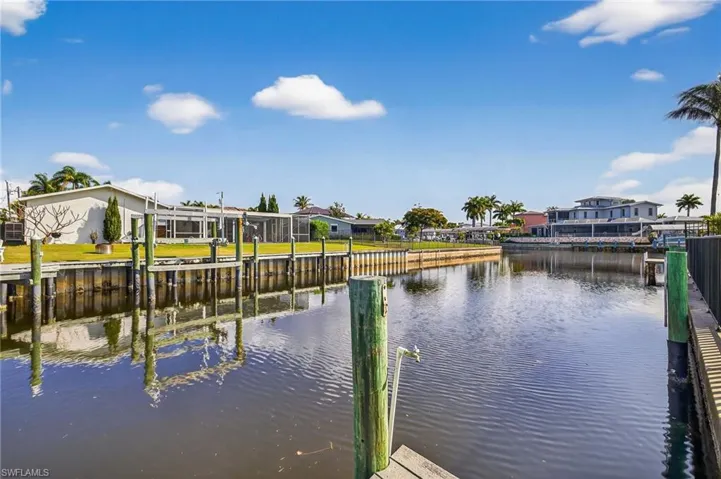 Dock area featuring a water view and a residential view