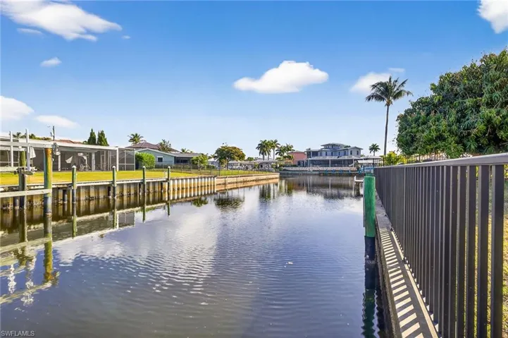 Dock with a water view and a residential view