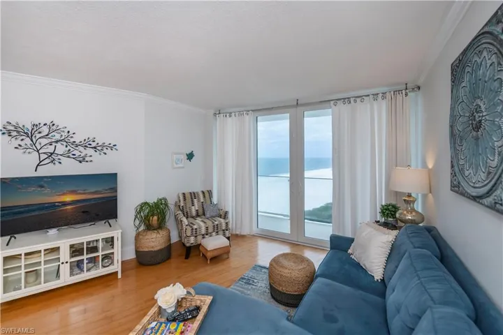 Living room featuring crown and bamboo floors