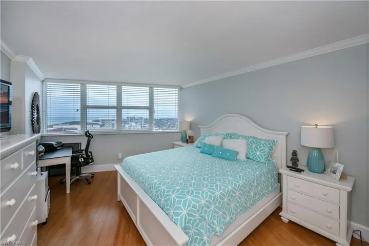Master Bedroom featuring  bamboo floorsflooring and crown molding