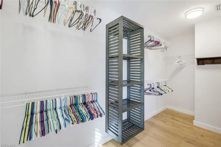 Spacious closet with visible vents and wood finished floors