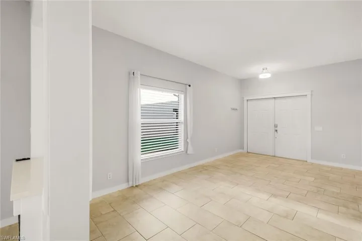 Empty room featuring baseboards