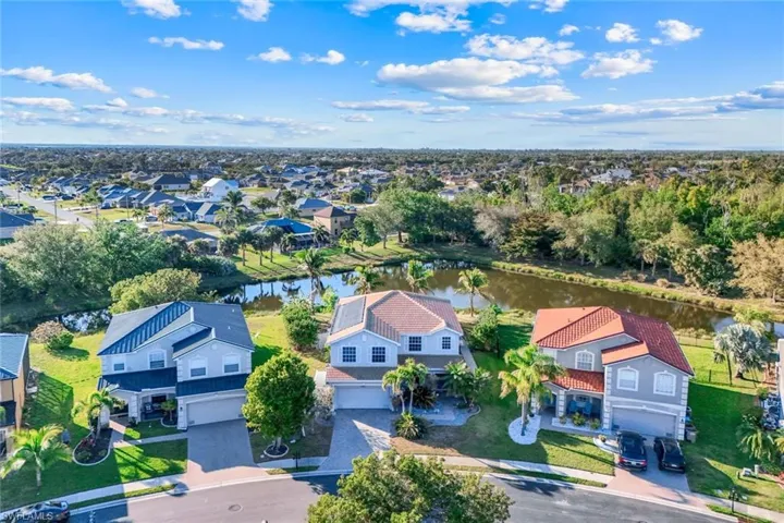 Aerial view featuring a residential view and a water view