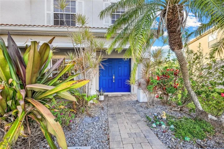 View of exterior entry with stucco siding