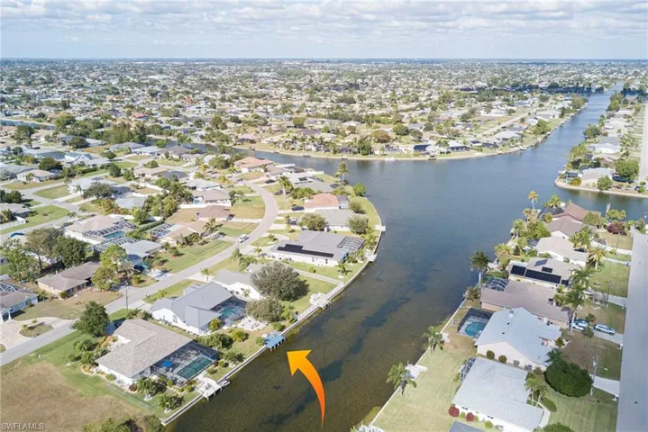 View of property location with nearby suburban area and a large body of water