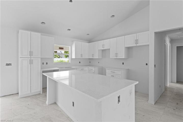 Quartz countertops in kitchen and baths.