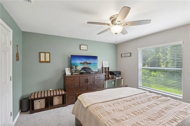 Bedroom with carpet floors and ceiling fan