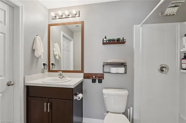Bathroom with vanity and a shower