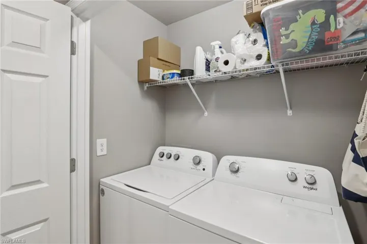 Laundry room with washing machine and clothes dryer
