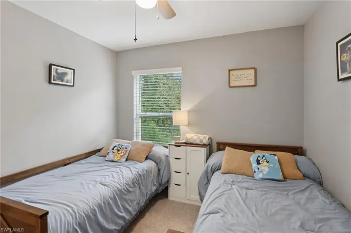 Bedroom featuring carpet and ceiling fan