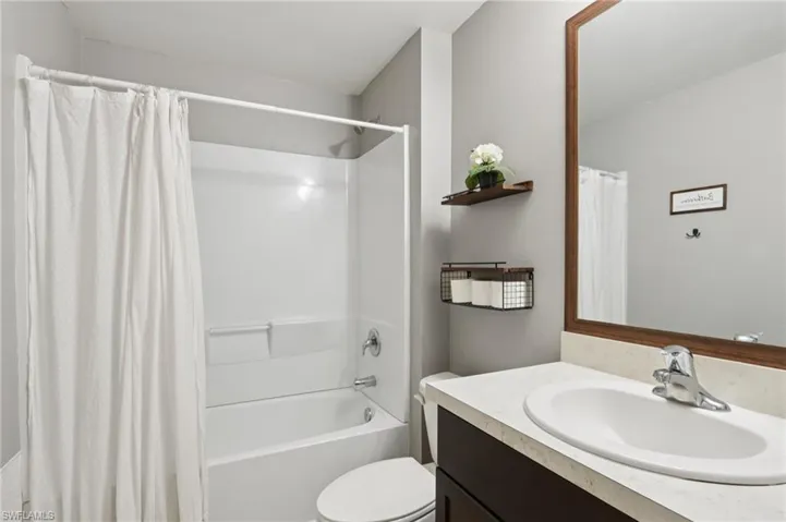 Full bath with vanity and shower / bathtub combination with curtain
