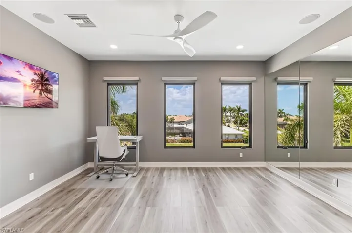 Exicersise Room or office featuring wood finished floors, a ceiling fan, and recessed lighting