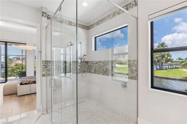 Bathroom with ensuite bath and a shower stall