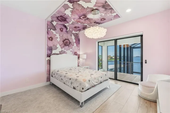 Tile deck with a water view and a ceiling fan
